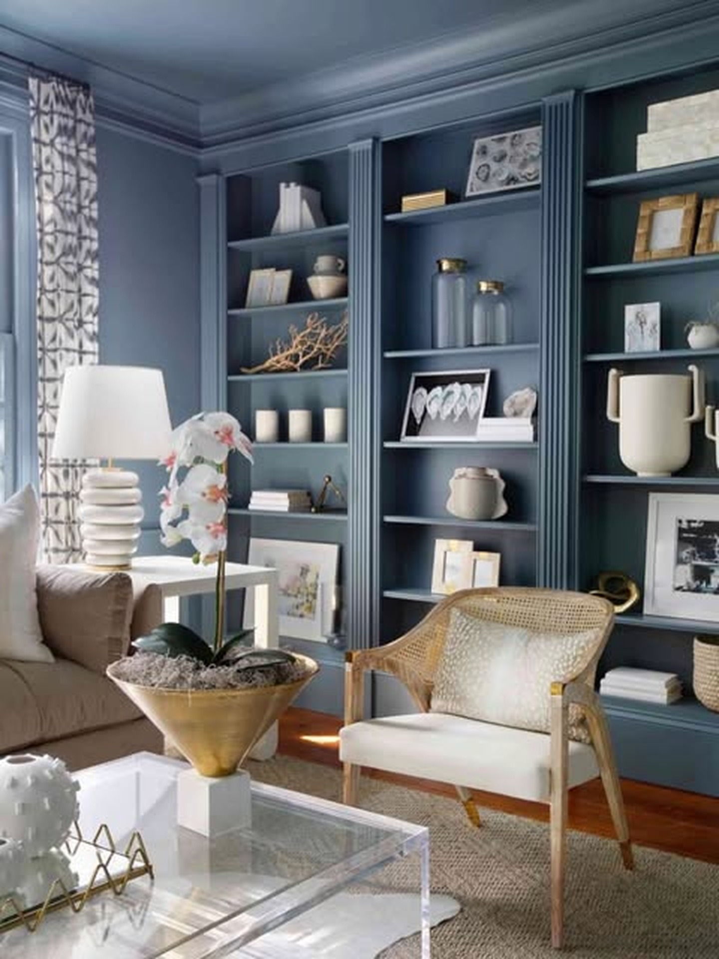 Living room by PBL Interior Painting with blue-gray painted built-in shelving and walls